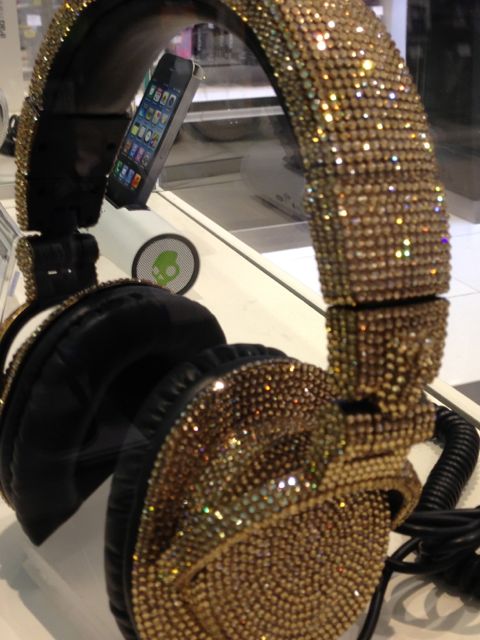 fancy, sparkly headphones in airport store display case