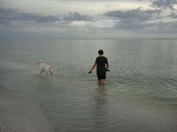 Boy and his Dog at the beach