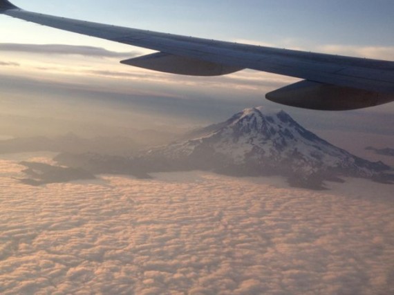 Mt Rainier rising above the clouds just after sunrise