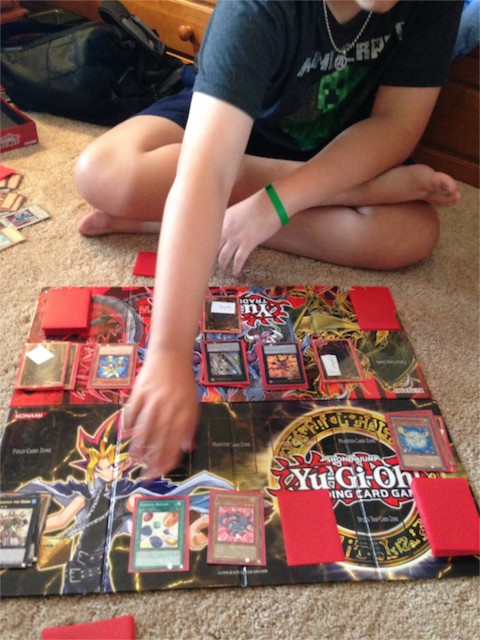 Father and Son playing Yugioh card game