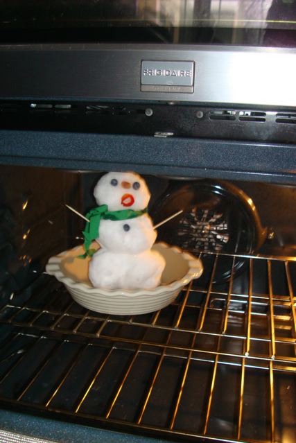 Small snowman placed in oven
