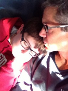 father and Son snuggling on cross country flight