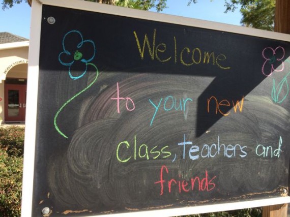 Colorful welcome sign on parking lot chalk board