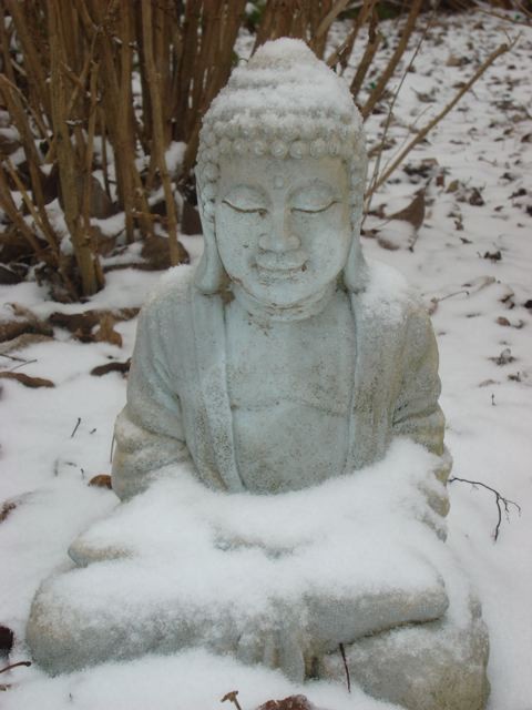 Buddha statue covered in snow