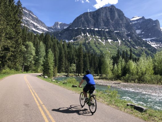 man riding bike in mountains