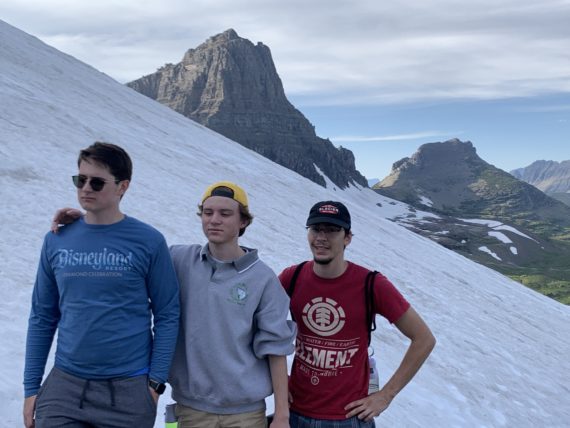 3 young men in snow mountains