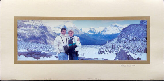 couple posing in snowy mountains