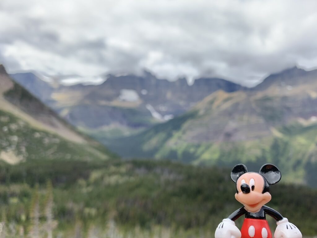 Mickey mouse toy figurine in the mountains