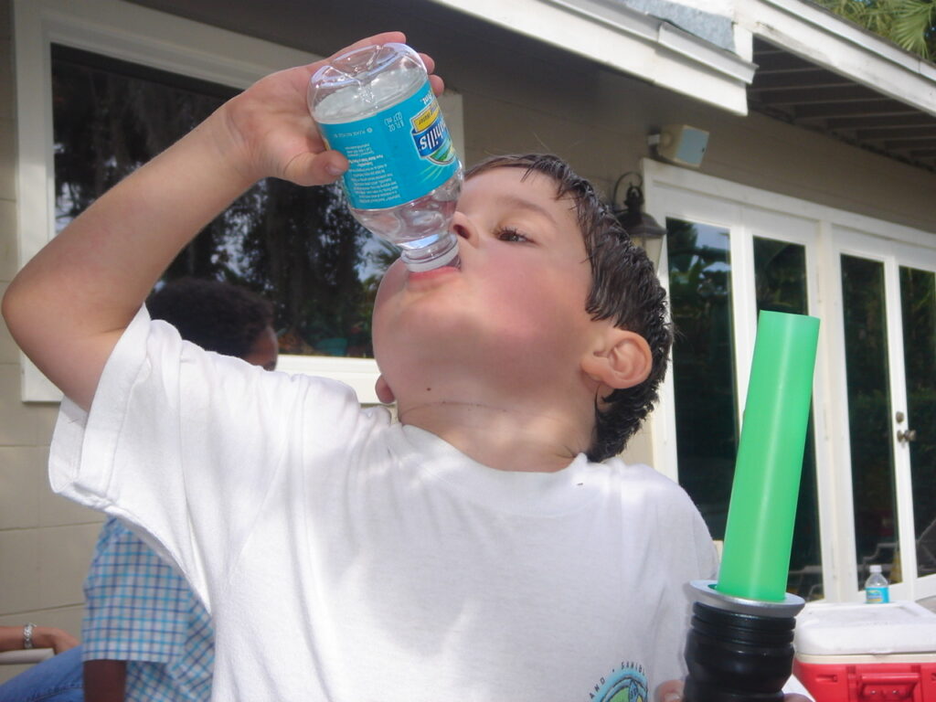 child chugging water