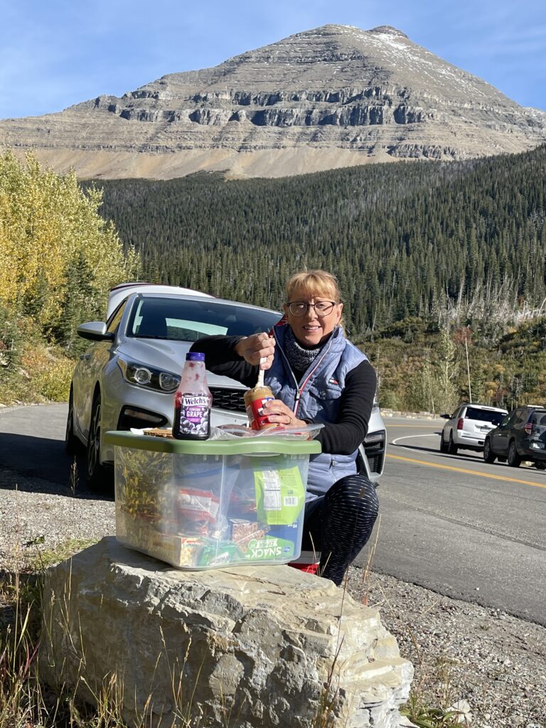 Woman making PBJ sandwich roadside