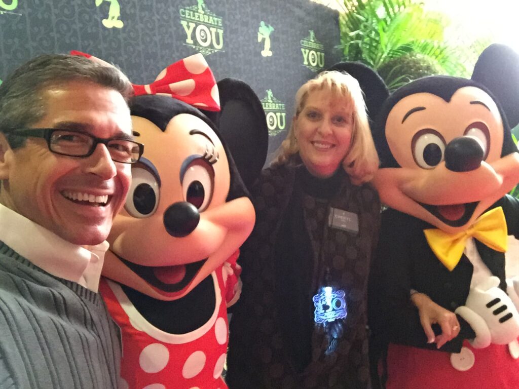 Disney Leadership speaker, his wife, and Mickey and Minnie Mouse