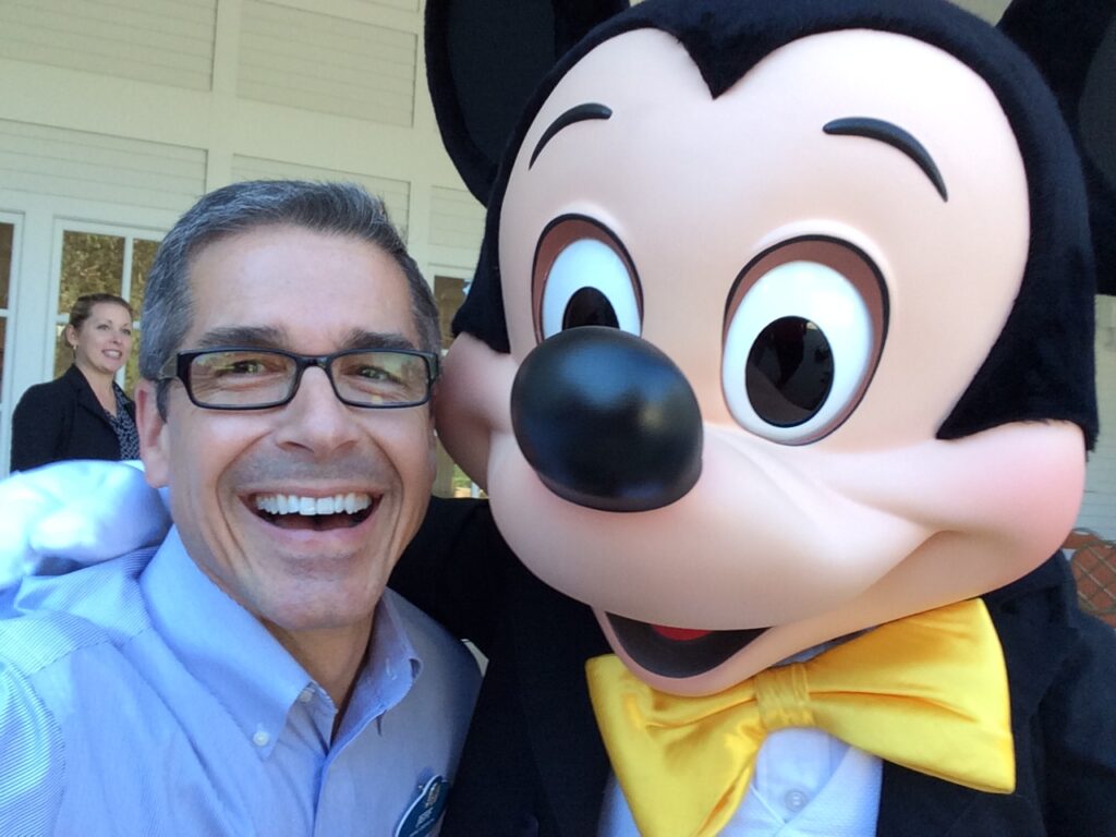 Disney Institute Keynote Speaker Jeff Noel with Mickey Mouse