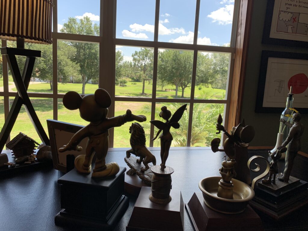 Disney Service award trophies on a desk