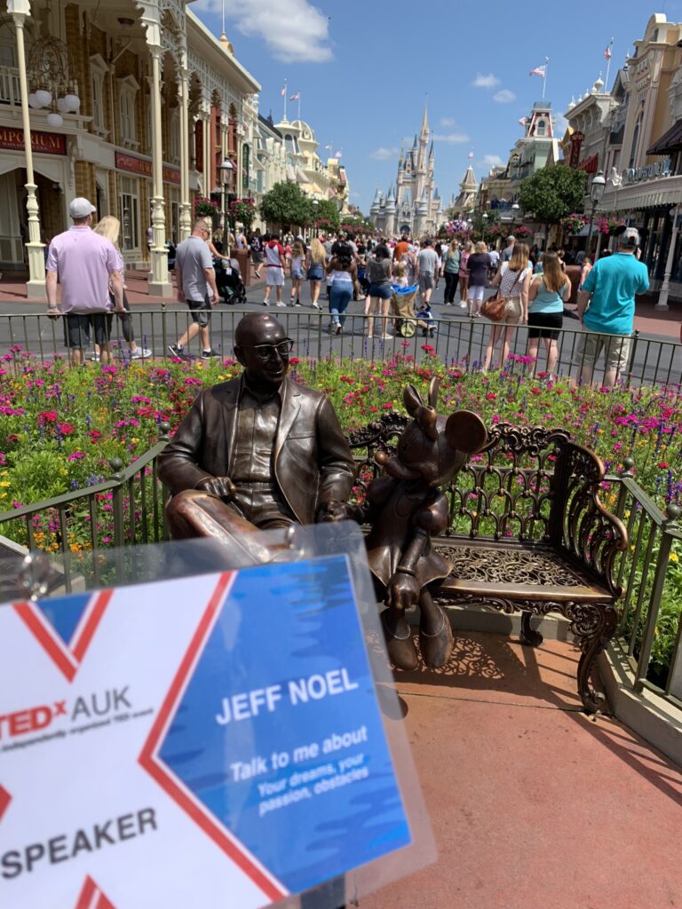 Roy Disney stature at Magic Kingdom and TEDx speaker id