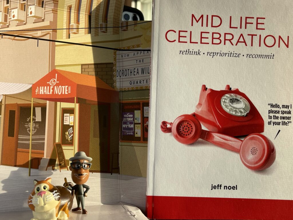 Mid Life Celebration book and Pixar Soul toys
