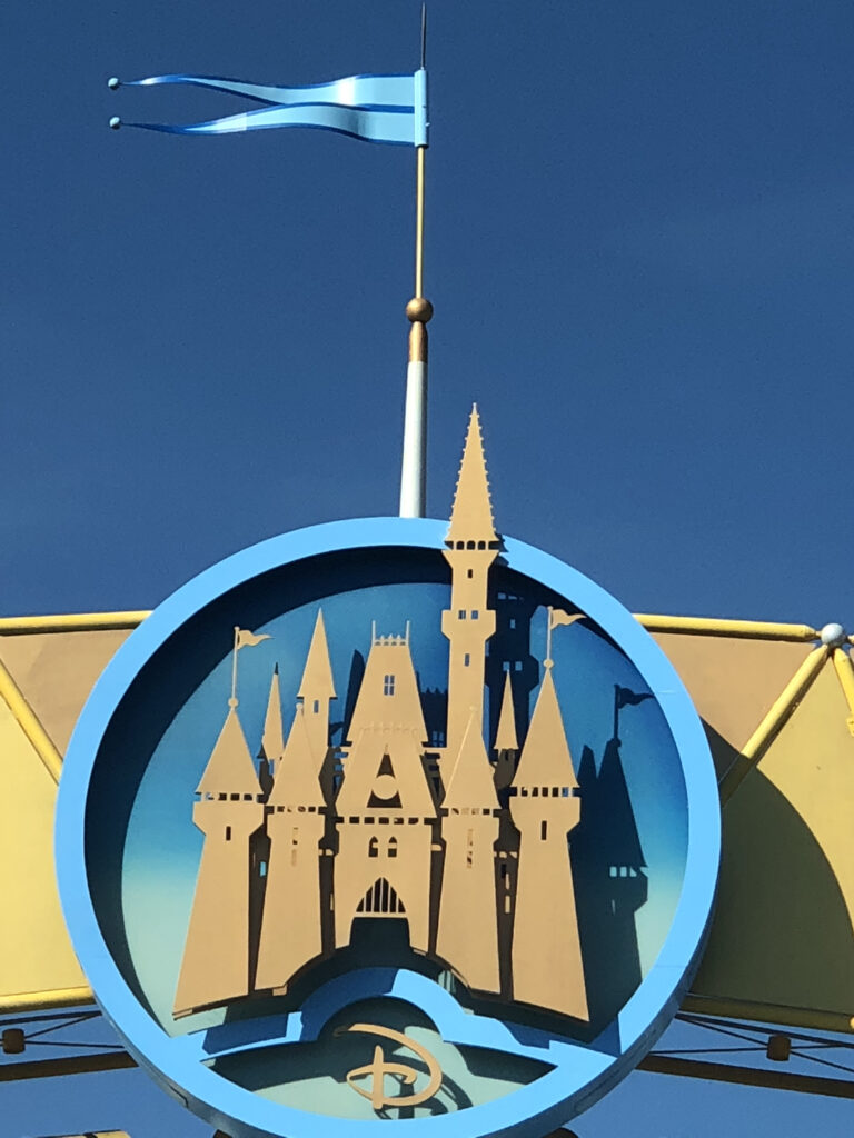 magic kingdom toll plaza entrance logo