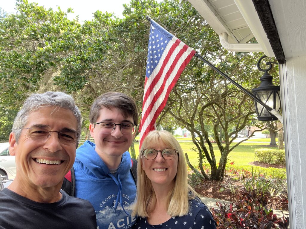 family of three by American Flag