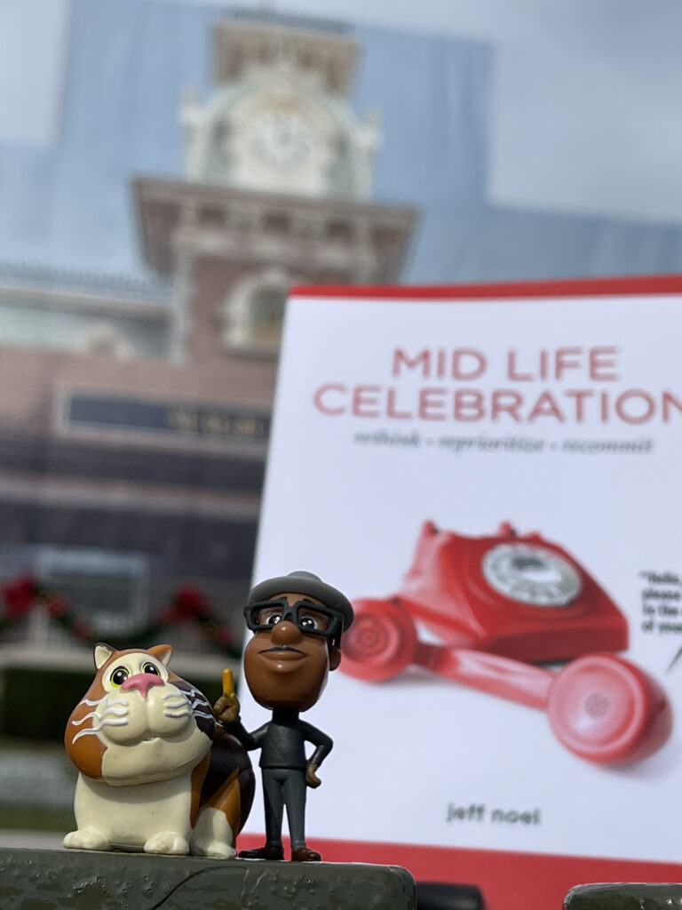 Mid Life Celebration book at Disney's Magic Kingdom entrance