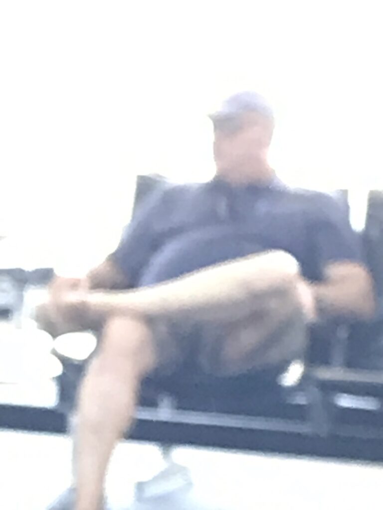 Person sitting on a chair in a blurry photo