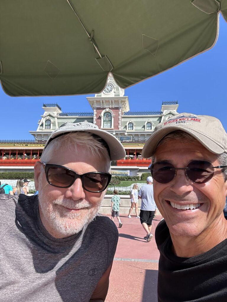 Two retirees at Magic Kingdom entrance