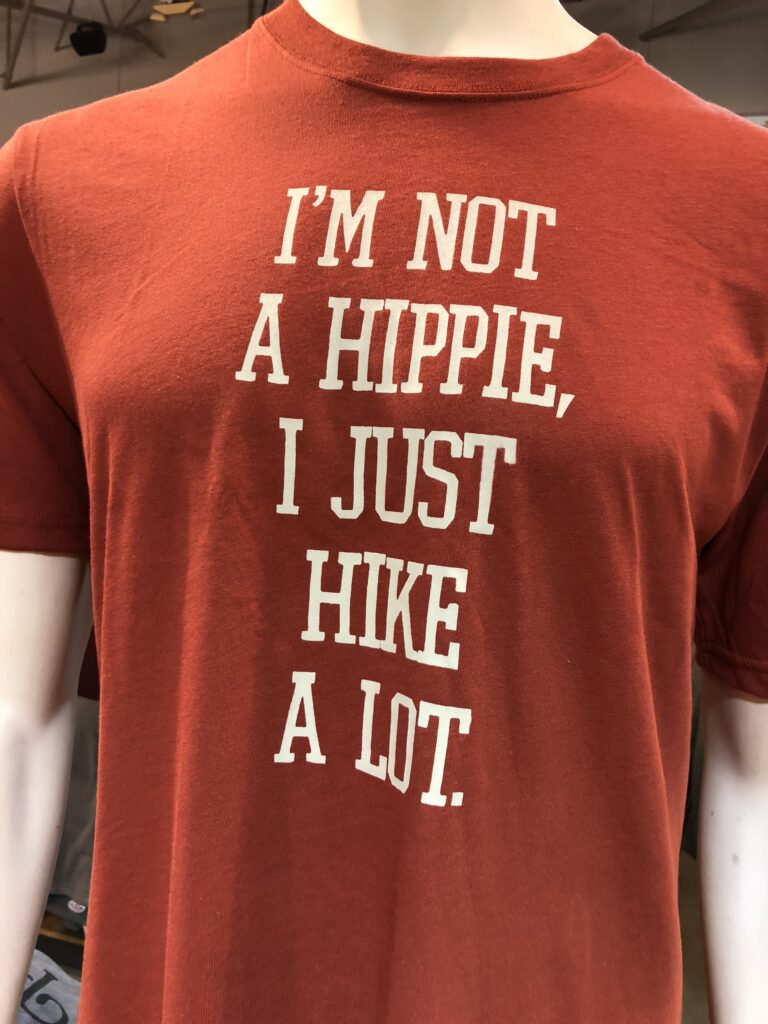 Red tshirt with a hippie hiker saying