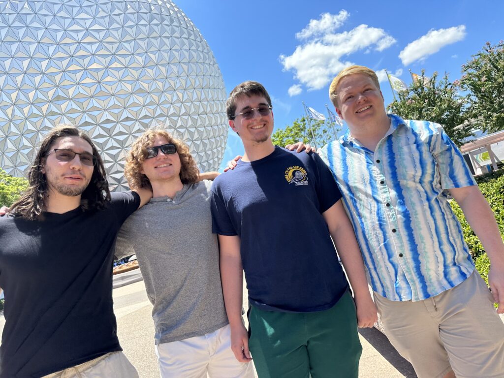 four friends by Epcot's Spaceship Earth