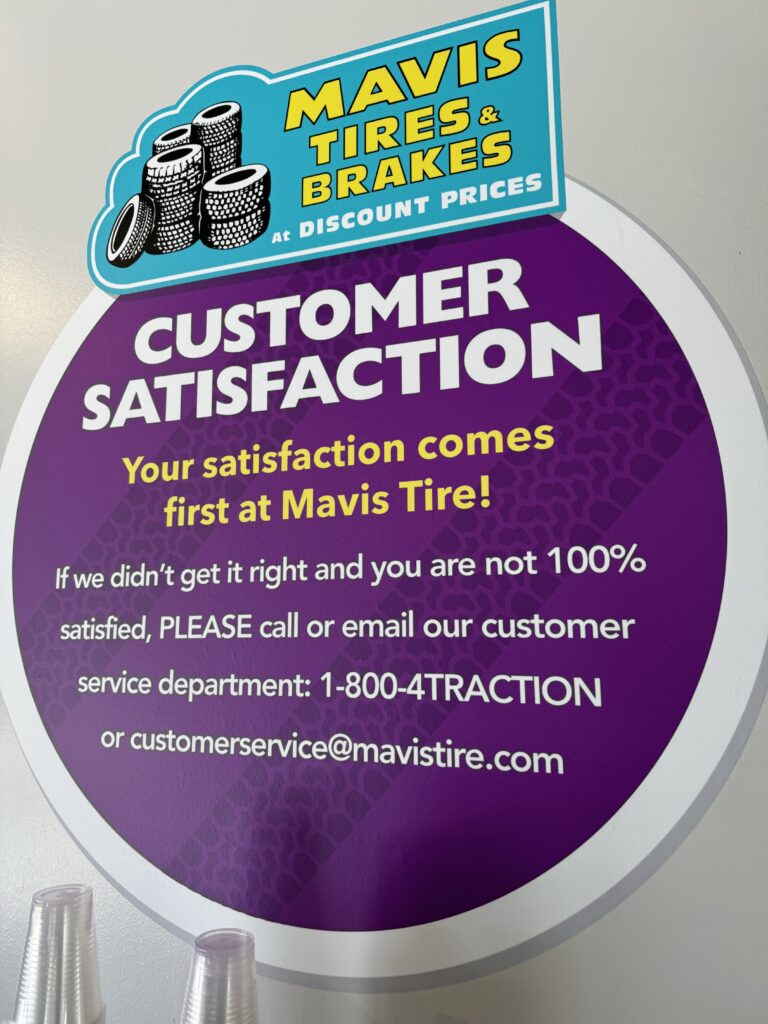 Tire shop customer service promise sign