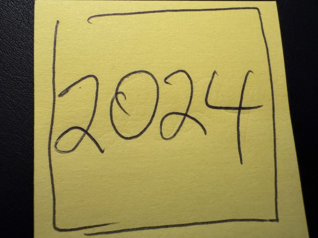 Yellow Post-it note with 2024 written on it