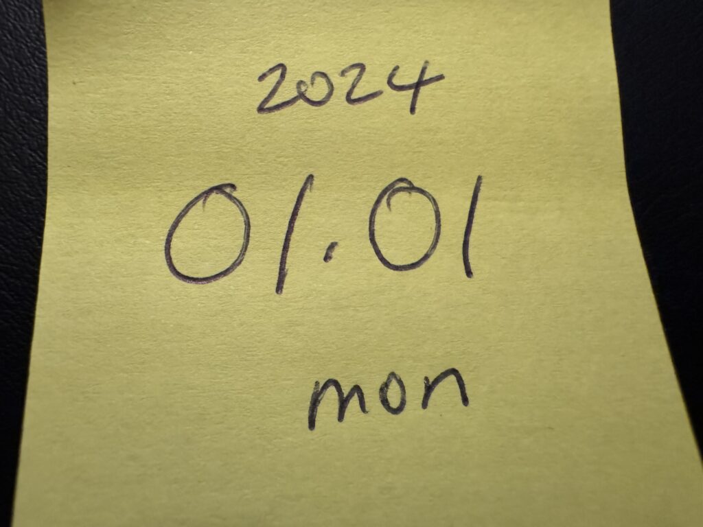 Yellow Post-it note with numbers on it