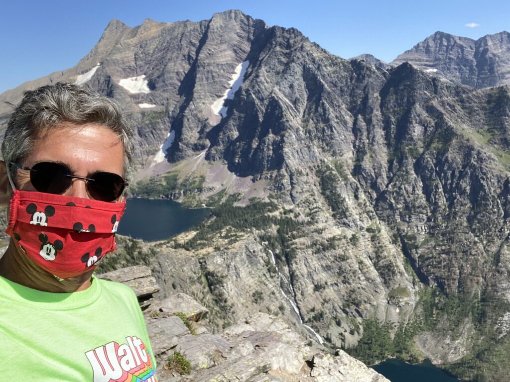 Man wearing a mask in the mountains