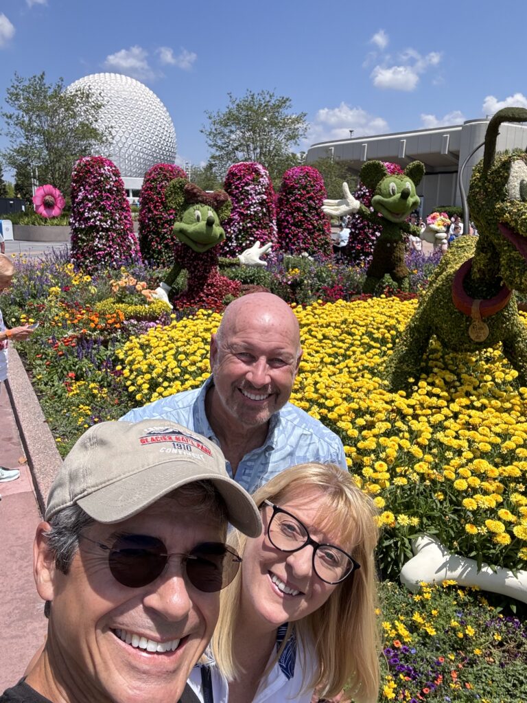 Three adults at Epcot flower and garden festival