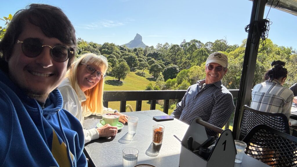 Three adults at an outdoor mountain Café