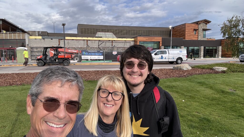 Three people at an airport