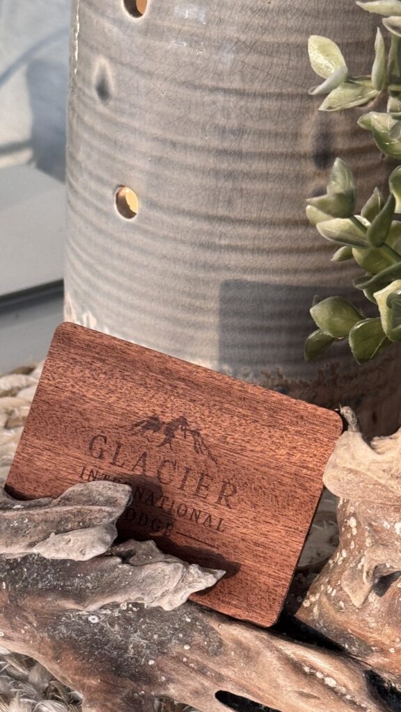wooden hotel room key by a ceramic pot
