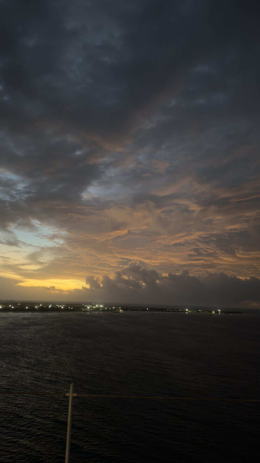 Island sunrise from cruise ship deck