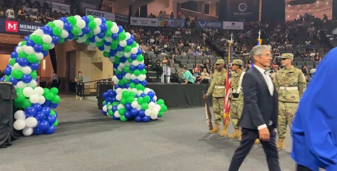 balloons and a man in an arena event