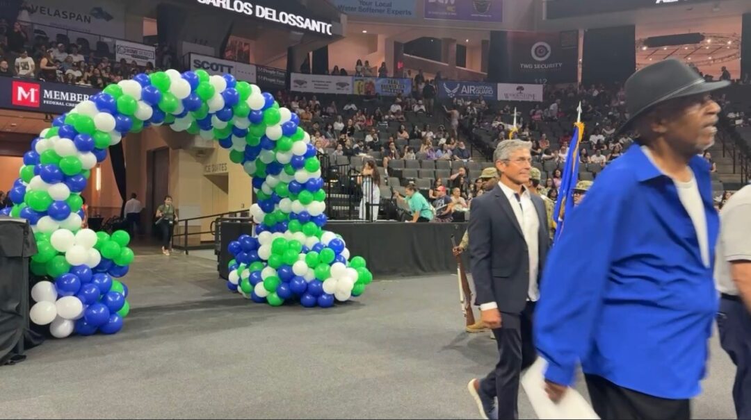 balloons and a man in an arena event