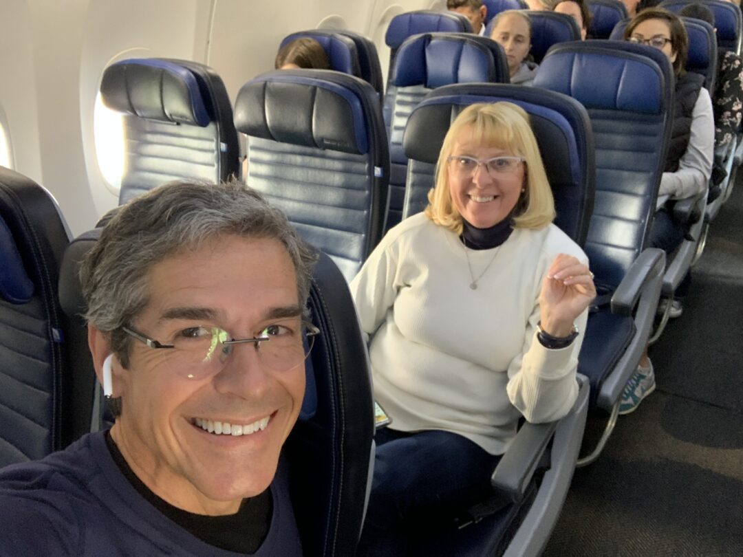 two seniors on a plane